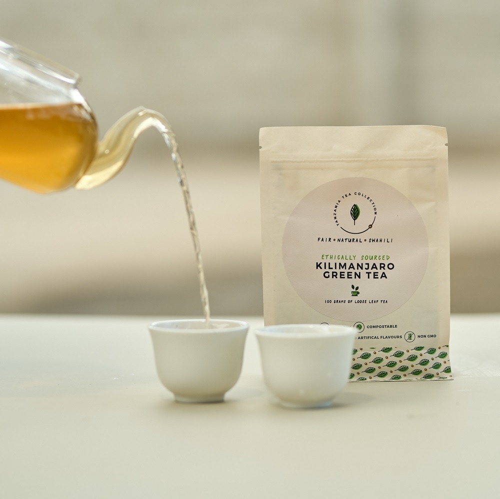 kazi-yetu-kilimanjaro-green-tea-pouring-from-tea-pot-to-cup